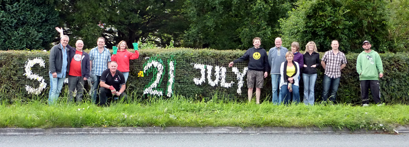 Putting up the North Road Banner for Pilton Festival Green Man Day